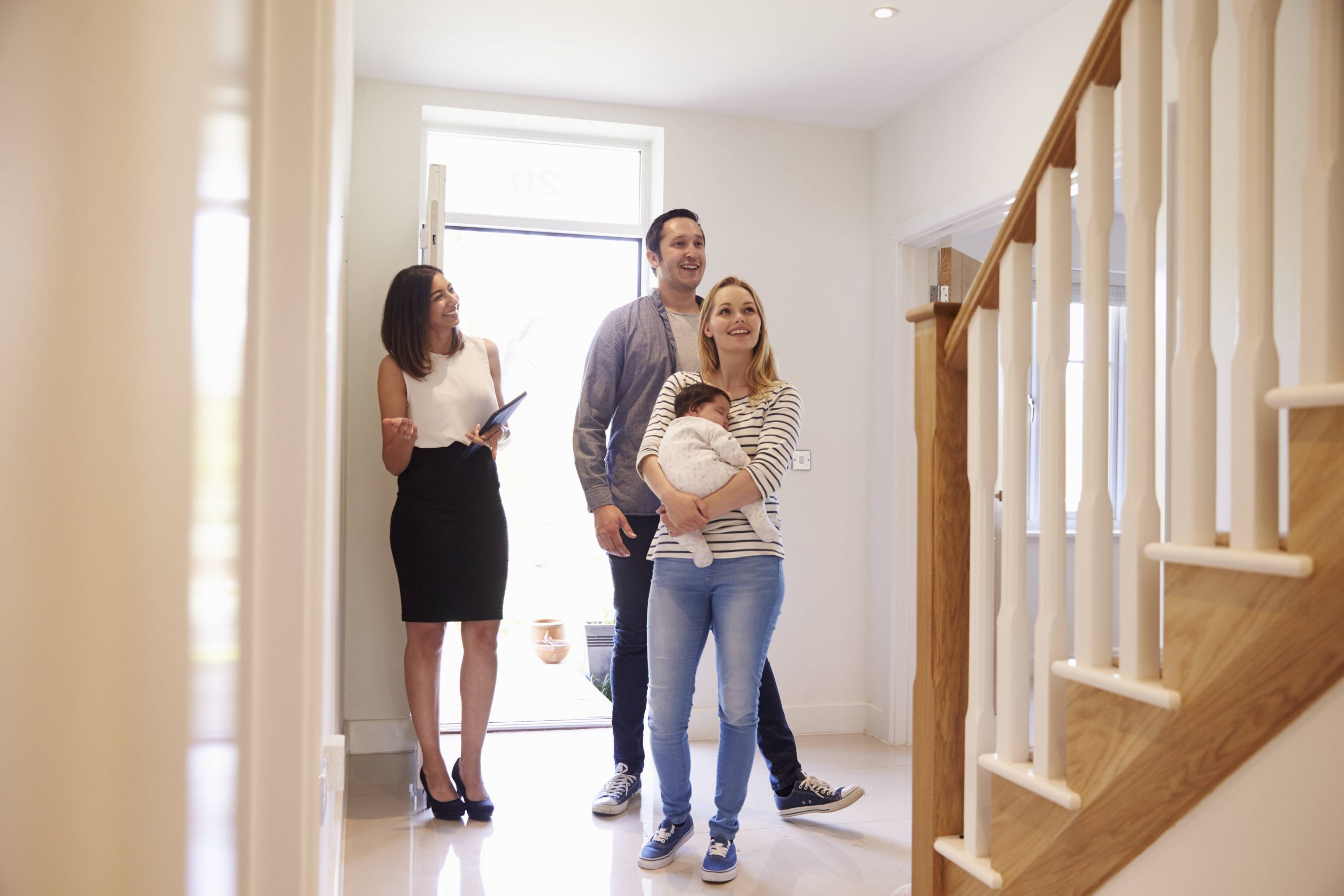 Real Estate Agent showing family a home